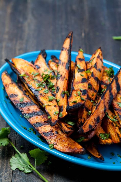 These Smokey Grilled Sweet Potato Fries are full of flavor. They're super simple to whip up and contain only 4 ingredients! Grilled Sweet Potato Fries, Grilled Potato Wedges, Sweet Potato Fries Recipe, Grilled Vegetable Recipes, Sweet Potato Recipes Fries, Grilled Sweet Potatoes, Sweet Potato Wedges, Grilled Potatoes, Summer Grilling Recipes