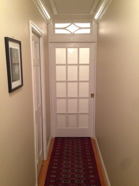 Frosted glass pocket door and transom bisects long hallway and adds privacy to master bedroom suite. Hallway Privacy Door, Bedroom Door With Glass Panels, End Of Hallway Closet Door Ideas, Add Door To Hallway, Pocket Door Hallway, Door To Close Off Hallway, Door At End Of Hallway, Door For Hallway, Dining Room Conversion