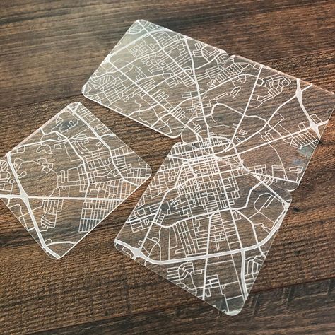 "This set of 4 square acrylic coasters contains the street map of your choice engraved on each one. Put the 4 coasters together like a puzzle to form the full map! A beautiful display piece as well as a practical table saver! Each coaster measures 4x4\" and .18\" thick. **Please include a city, address, intersection, or point of interest in the personalization section as a center point of your map. You may choose to receive a proof of the map engrave before it is printed for an extra $2." Puzzle Coasters, Acrylic Engraving, Coasters Design, Etched Acrylic, Acrylic Coasters, Map Coasters, Map Signs, Map Puzzle, Interactive Walls