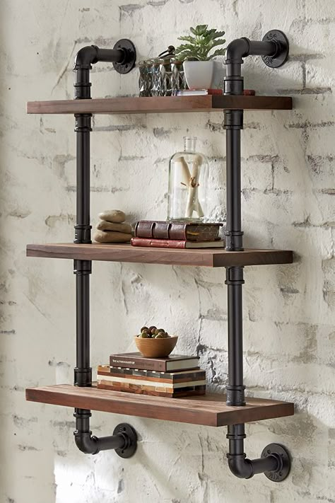 Give your space a soft, industrial vibe by adding pipe shelves, skip the DIY and install these ready-made shelves as a stylish, functional piece of decor. Living Room Industrial, Koti Diy, Industrial Pipe Shelves, Pipe Decor, Diy Pipe, Farmhouse Shelves, Pipe Furniture, Pipe Shelves, Industrial Pipe