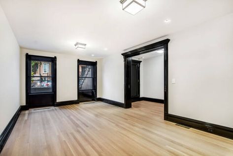 Black Trim Baseboards, Black Trim Light Floors, White Walls Black Molding, Black Wall Trim Interior, Black Painted Moldings And Trim, Interior Black Trim And Doors, Black Woodwork Trim Interior Design, White Bedroom Black Trim, Black Skirting Boards Living Room