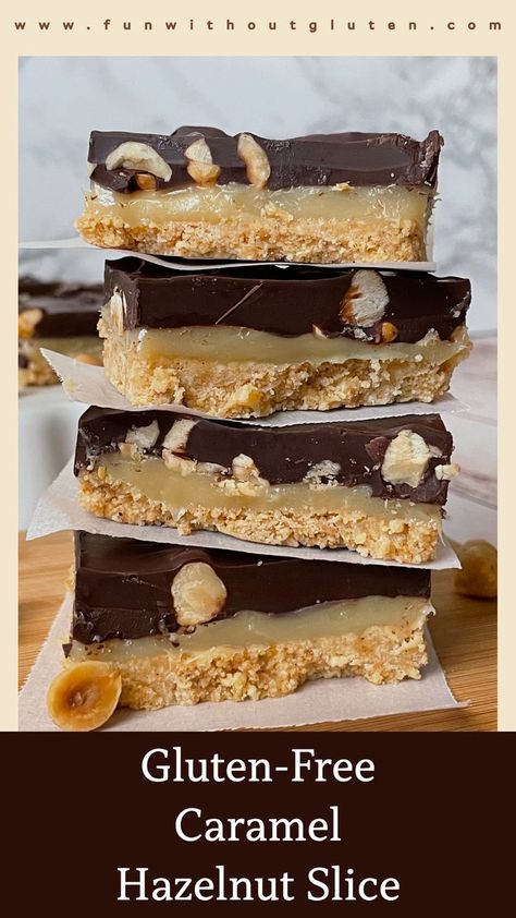 Several gluten-free caramel hazelnut slices stacked on top of eachother with some more slices behind them on a platter. Caramel Hazelnut, Refined Sugar Free Recipes, Caramel Slice, Being Rich, Gluten Free Biscuits, Caramel Bars, Digestive Biscuits, Chocolate Topping, Golden Syrup