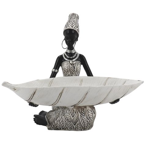 PRICES MAY VARY. An Ideal Home Décor with Cultivation：The Lescafita's African Tribal Lady Holders Figurine enriches with African cultural symbolic meaning. The Offering Leaf represents our gratitude for the prosperity that the mother of nature has provided us. The White color, like many other cultures, symbolizes purity in spirituality. The Materials：We used polyresin as the primary material, and it is scentless, non-toxic, and friendly to the environment. Lescafita's artisans handcrafted each f Figurine, African Sculptures, Doll Diy Crafts, Wedding Church, African Decor, Bookshelf Decor, African Elephant, Brushed Bronze, Sculptures & Statues