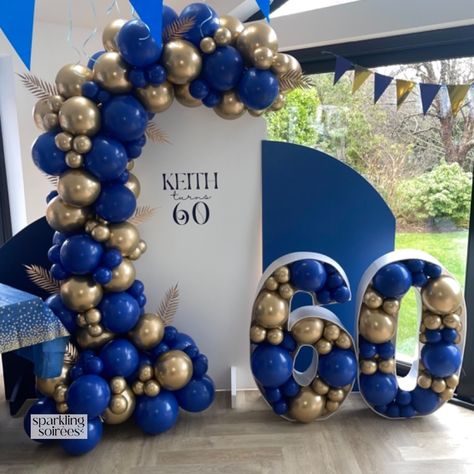 Inspo for Mens’s Birthday Decor. Celebrating 60 in Style with this Backdrop and Balloon Display in Royal/Navy Blue and Gold. With 3 x Sailboard Backdrops, Vinyl Personalisation, Balloon Garland and Balloon Mosaic ‘60’. #mensbirthday #birthdaydecorationsfordad #birthdaydecoration #balloongarland #balloonmosaic #60thbirthday Men 60th Birthday Party Ideas Decoration, Balloon Garland For Men, Royal Blue Balloon Garland, Birthday Backdrop For Men, 60th Birthday Party Themes, Blue And Gold Birthday, 60th Birthday Ideas For Mom, Navy Blue Backdrop, Balloon Mosaic