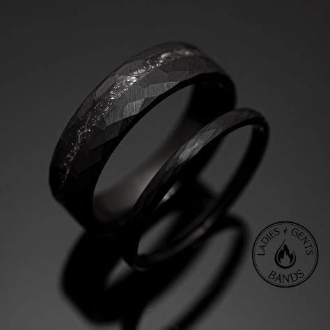 Your wedding ring set order includes + One 6mm Black Hammered Obsidian-styled tungsten Wedding Band with Meteorite inlay + One 2mm Black Hammered Obsidian-styled tungsten Wedding Ring + Both Come inside Wax Sealed Ring Boxes. Limited Time: Free Matching Set of Black Silicone Bands w/ Order. + 1 YEAR WARRANTY for your Bands. *Durable - Incredibly Scratch-Resistant to always look great. *Comfort-fit & Weighty - Designed to fit well and feel good in your hand. *Made to order - Every ring we ship is unique and one-of-a-kind. *6mm - Most popular standard width for men *2mm - Most popular standard width for women *Hypoallergenic - No discomfort from metals. *Cobalt-Free - Will never turn your finger green or irritate. *Each buyer, a friend - Any issues? We'll take care of you. Message us, we ans Black Steel Wedding Rings, Black Men Wedding Ring, Black Wedding Bands His And Hers, Black Wedding Rings For Men, Black Wedding Bands For Men, Mens Obsidian Wedding Ring, Obsidian Wedding Band, Obsidian Ring Mens, Dark Titanium Wedding Band