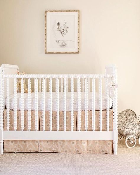 White spindle crib with a pink skirt in a sweet traditional girls nursery boasting a gray Greek key carpet and dainty decor. Spindle Crib Nursery, Serena And Lily Nursery Girl, Pink Traditional Nursery, Spindle Crib, White Jenny Lind Crib, White Crib Nursery, Scallop Crib Skirt, Baby Girl Crib Skirt, White Eyelet Crib Skirt