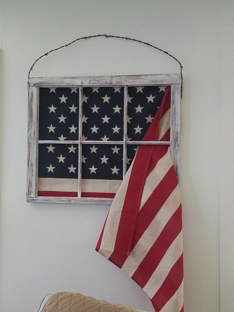 A very old window we found on the farm farmed painted and distressed with a touch of red add an American flag and a barbed wire hanger rustic patriotism Window Pane Decor, 4th Party Ideas, Old Window Frames, Wire Hanger, Wire Hangers, Window Pane, Barbed Wire, Window Frames, Florida Home