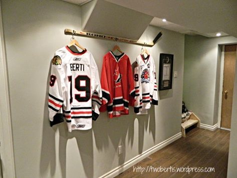 hang your jersey off of a stick in your hockey basement Hockey Man Cave, Sports Pictures Display, Hockey Bedroom, Hockey Decor, Hockey Room, Ideas Habitaciones, Jersey Display, The Bat Man, Man Cave Basement