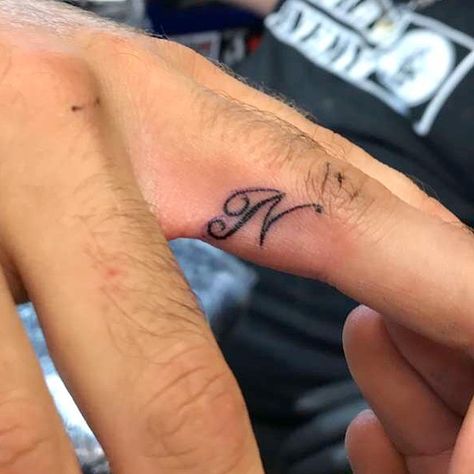 Ring finger tattoo initial ‘N’ Finger Tattoo Initial, N Letter Tattoo, Ring Finger Tattoo, N Tattoo, N Letter, Ring Tattoo, Letter Tattoo, Tattoo Spots, Tattoos Infinity