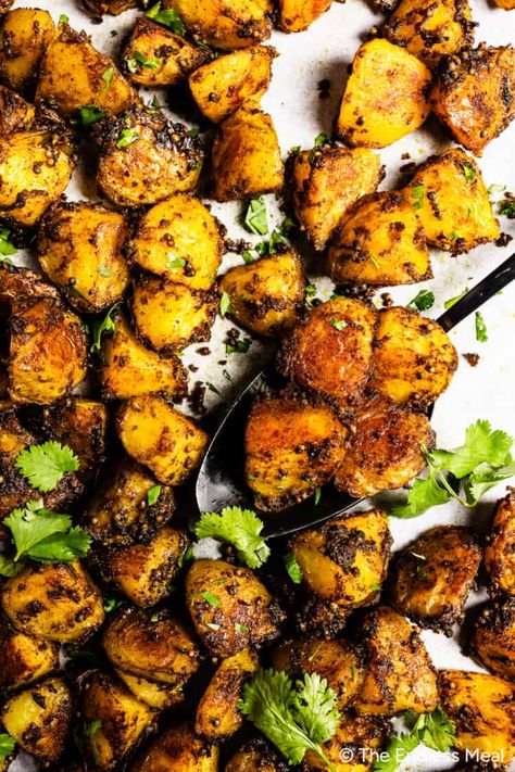 Aromatic and comforting, these Bombay potatoes are bursting with flavor! Parboil potatoes, generously coat them in an easy to make curry oil, then roast them to fragrant, crispy perfection. The potatoes are a hearty and satisfying base to rich and aromatic spices, blending flavor and comfort food into an incredible Indian-inspired side dish. #theendlessmeal #potatoes #bombaypotatoes #roastpotatoes #roastedpotatoes #dinner #sidedish #curry Indian Potato Recipes, Self Note, Curry Side Dishes, Parboiled Potatoes, Bombay Potatoes, Indian Soup, Indian Side Dishes, Spring Mix Salad, Masala Sauce