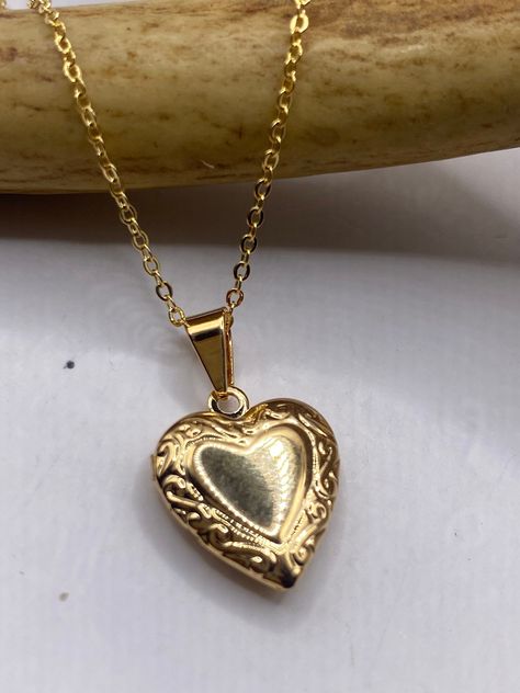 "Please note, this locket will be ready to ship the second week of March Vintage Gold Photo Locket is crafted in 9K Gold Filled, features a lovely, etched design and measures 1/2\"x 1/2\" (Without Bale)  Holds a tiny photo for wear as a dainty memory necklace.  We recommend using a laminated photo for longer lasting wear Delicate 9K GF gold chain available in lengths of 16, 18 ,20, 22\" or 24\" Thank you for supporting a small veteran owned business! All jewelry is shipped free within the US in Dainty Gold Locket, Gold Vintage Necklaces, Cute Vintage Jewelry, Vintage Jewelry Gold, Classic Gold Locket Necklace With Vintage Charm, Yellow Gold Heart Pendant Locket Necklace With Vintage Charm, Antique Gold Locket Necklace With Heart Charm, Antique Gold Heart Charm Locket Necklace Gift, Vintage Gold Locket