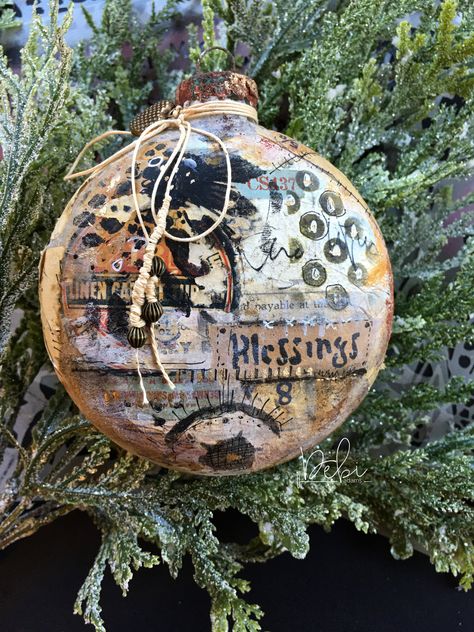 A unique and different way to take mixed media art.  Check out this collaged glass ornament using gesso, ephemera and StencilGirl® stencils. Project by Debi Adams. #stencilgirl #mixedmedia #ornament #christmasornament #layers #ephemera Mixed Media Christmas, White Sharpie, Mixed Media Diy, Canvas Art Projects, Mary Engelbreit, Wood Christmas Ornaments, Wood Christmas, Pink Paint, Hand Painted Ornaments