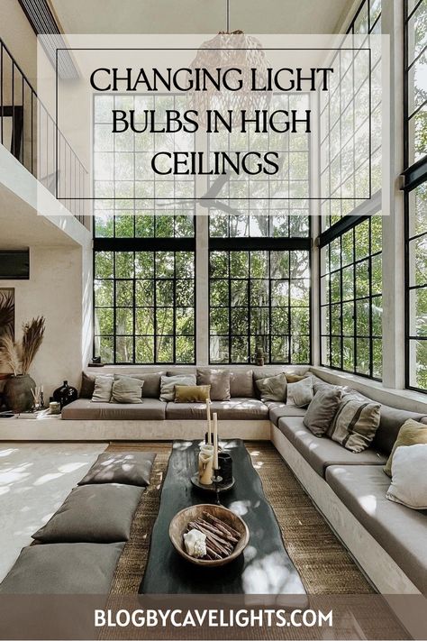 🛠️ Simplify your high ceiling house interiors lighting updates with our bulb-changing guide. Safe, easy, and quick! Tap to learn more. 🏠💡 Ceiling House Interiors, High Ceiling House Interiors, High Ceiling House, How To Clean Chandelier, High Ceiling Kitchen, High Ceiling Decorating, High Ceiling Lighting, Lighting Updates, Metal Wall Light