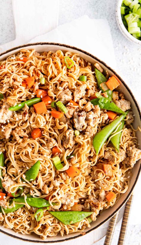 Make this quick and easy chicken noodle stir fry for a delicious, better-than-takeout meal at home! Made with ground chicken, fresh veggies, and a savory soy glaze, this dish is perfect for busy weeknights. It's budget-friendly, customizable, and will become a requested family favorite. Try it tonight and enjoy a tasty, homemade fakeaway dinner that's ready in just about 20 minutes! #stirfry #ramen #easyrecipes #weeknightdinner #homemadecooking #fakeaway #takeout Ground Chicken Ramen Noodle Recipes, Chicken Stir Fry With Rice Noodles, Ground Chicken Ramen, Ground Chicken Ramen Stir Fry, Quick Chicken Ramen Noodle Stir Fry Damn Delicious, Chicken Stir Fry With Vegetables And Rice Noodles, Spicy Chicken Stir Fry With Noodles, Best Ramen Recipe, Chicken Ramen Noodle Recipes