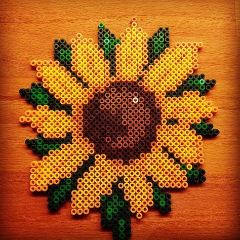 Sunflower hama beads by perlemor1                              … Melty Bead Patterns, Pearl Beads Pattern, Fuse Bead Patterns, Hama Beads Design, Perler Bead Templates, Perler Crafts, Hama Bead, Hama Beads Patterns, Diy Perler Beads