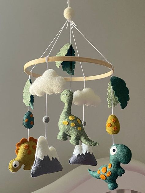 Dinosaur themed baby mobile featuring three different dinosaurs. Baby handmade mobile with felt dinosaur for baby boy or girl nursery. The adorable dinosaur can be a perfect element for your baby nursery. You can put the mobile above a crib, a changing table or a reading corner. Your children will Baby Boy Dinosaur Nursery, Dinosaur Nursery Baby Boy, Baby Mobile Diy, Crib Mobile Boy, Dinosaur Mobile, Felt Dinosaur, Dino Nursery, Mobile Ideas, Felt Baby Mobile