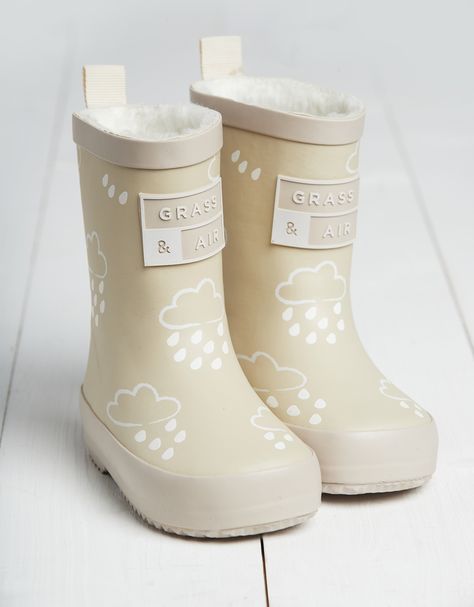 Whether it's forecast to rain or you're taking a trip to the seaside, Grass and Air make the ultimate rainwear for little ones to splash around in. From wellies to umbrellas, there's something extra-special about these pieces when they get wet...Muddy puddles, here we come! These wellies are a staple for rainy days, with a comfortable fleece lining that keeps little feet happy all day long. But the best part? They include a colour-revealing print that transforms from white to multicoloured – try Welly Socks, Air Stone, Wellies Boots, Teddy Fleece, Stone Colour, Kids Fleece, Colour Changing, Holidays With Kids, Kids Boots