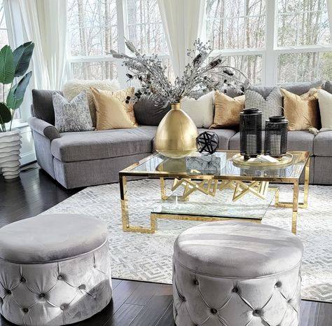 Gray Couch With Gold Coffee Table, Gray Couch Gold Accents, Gray And Gold Living Room Decor, Grey White And Gold Living Room, Gray And Gold Living Room, Gold And Glass Coffee Table, Tufted Ottomans, Pop Art Interior Design, Silver Living Room