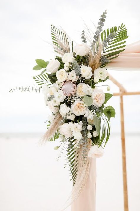 Tropical Beach Inspired Wedding Ceremony Decor, Ivory and Blush Pink Garden Roses, Silver Dollar Eucalyptus, Pink Protea Palm Leaf Floral Bouquet on Bamboo Ceremony Arch | Clearwater Beach Photographer Lifelong Photography Studios Pink Protea, Clearwater Beach Wedding, Florida Destination Wedding, Dollar Eucalyptus, Tropical Wedding Flowers, Beach Wedding Reception, Beach Wedding Flowers, Beach Pink, Photography Studios