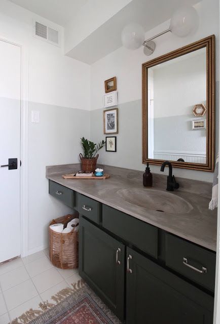 I redid our bathroom with a few purchased pieces and a whole bunch of diy. You can make the best of a space by working with what you've got! | House Homemade Concrete Countertops Bathroom, Master Bath Renovation, New Paint Colors, Concrete Bathroom, Bamboo Mirror, Concrete Counter, Bath Renovation, Green Cabinets, Bathroom Redo