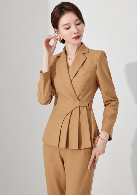 Introducing our Camel Chic Belted Blazer Set. Meticulously tailored to enhance your silhouette, it brings a fresh perspective to power dressing. The single-breasted blazer features a cinched waist and a playful peplum flare, while the smart belt detail adds a modern twist to the classic piece. Paired with comfortable y Blazers Jacket For Women, Ladies Blazer Design, Model Blazer, Stylish Blazer, Ladies Blazer, Blazer Jackets For Women, Fresh Perspective, Stylish Suit, Navy Blue Pants