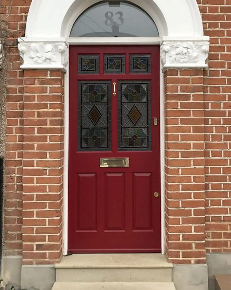 Deep red Edwardian entrance door with intricately set stained glass panels and brass door furniture. A sophisticated example of early 20th century styling. External Glass Doors, Oak Front Doors, Front Doors Uk, Front Door Styles, Red Front Door, Door Paint, Front Door Paint Colors, Victorian Door, Stained Glass Door