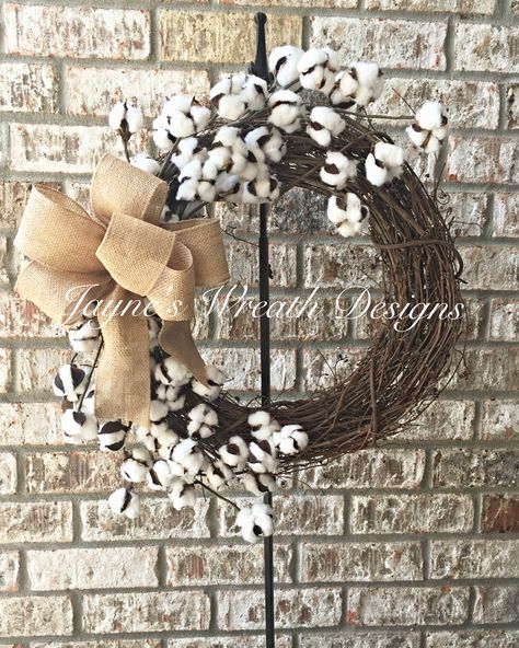 Cotton Boll Grapevine Wreath with Burlap Bow. Great indoor or outdoor wreath. By Jayne's wreath designs on fb and Instagram Christmas Wreath With Cotton, White Grapevine Wreath Christmas, Cotton Stem Wreath, Cotton Grapevine Wreath, Cotton Ball Wreath, Haning Grapevine Wreaths, Wreath With Cotton, Cotton Bolls, Wreath With Burlap