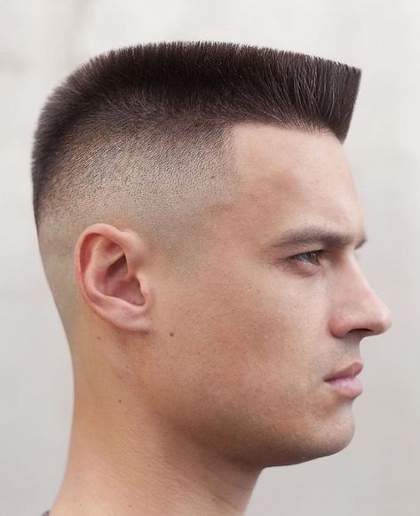 You can also go for the modern flat top. It features a square cut on top, which is good as it will not have an inverse contrast with your square face’s bone structure. The reason behind this is that the sides have a high fade, which ensures that the cut remains tall and narrow. Flat Top Fade, Military Haircuts Men, Military Hair, Best Fade Haircuts, Top Hairstyles For Men, Flat Top Haircut, Military Haircut, Mens Haircuts, Mens Hair Trends