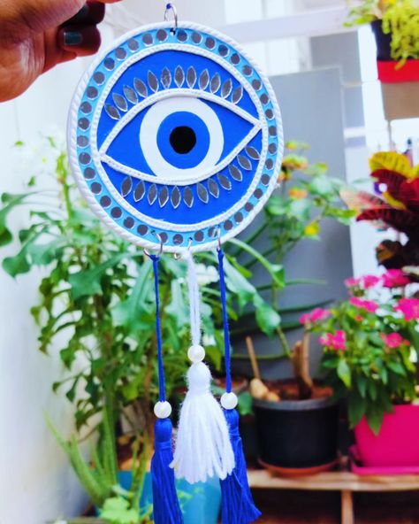 Fusing tradition with protection 🧿✨ This Lippan art evil eye with mirror work brings beauty and positivity to our home. . . . . . . . #LippanArt #EvilEye #MirrorWork #TraditionalArt #Handcrafted #HomeDecor #ProtectiveSymbols #ArtisticHome #UniqueWallArt #PositiveVibes #CreativeDecor #HandmadeWithLove #CulturalHeritage #BeautifulArt #HomeInspiration Evil Eye Lippan Art Design, Evil Eye Lippan Art, Lippan Art Mirror, Lippan Art Mirror Evil Eye, Evil Eye Diy Wall Hangings, Evil Eye Decor Wall Hangings, Evil Eye Hanging, Evil Eye Hanging Decor, Evil Eye Art