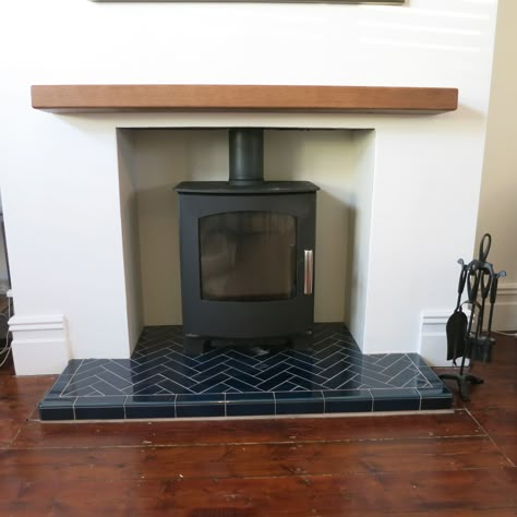 Stunning Mendip Churchill multi fuel stove with a blue herringbone tiled hearth Tiled Fireplace Herringbone, Tiled Stove Fireplace, Tile Hearth Wood Stove, Log Burner Hearth, Wood Burner Fireplace Tiles, Tiled Hearth Ideas Log Burner, Fireplace Tiled Hearth, Tiled Log Burner Fireplace, Log Burner Tiles