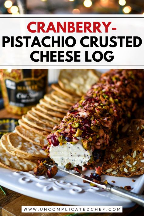 An image of Cranberry-Pistachio Crusted Cheese Log on a white plate Pistachio Cranberry Cheese Log, Cranberry Cheese Log Recipes, Cranberry Pistachio Cheese Ball, Appetizer Recipes No Cheese, Cheese Logs Appetizers, Honey Cranberry Cheese Log, Cranberry Cheese Log, Cranberry Pistachio Cheese Log, Cranberry Cheesecake Bites