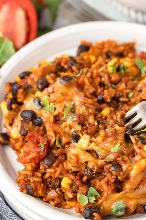 Sizzle up your dinner routine with this One-Pan Mexican Beef & Rice Skillet! Loaded with flavor, easy to make, and even easier to clean up. It's the perfect meal for a busy weeknight. Packed with savory beef, wholesome rice, black beans, and melty cheese, it's a family-pleasing feast. Get the full recipe at littlechefwithin.com and enjoy a fuss-free, fabulous dinner tonight! Cheesy Italian Rice Skillet, Weeknight Mexican Meals, Meals With Spanish Rice, Meals With Black Beans And Rice, Queso Taco Rice Skillet, Cheesy Beef Black Bean And Rice Skillet, Southwest Ground Beef Skillet, Healthy Black Beans And Rice, Taco Rice Skillet Beef