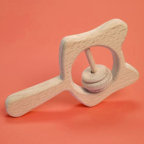 This Wooden Cat Rattle, crafted from eco-friendly wood purrs with joy, to create a safe experience for curious little hands, with each shake bringing a melody of comfort and fun. Order Now ! Link in Bio! #BrownCurves21 #WoodenRattles #WoodenAnimalToys #RattleToys #WoodenBabyToys #NaturalRattles #WoodenTeethers #SustainableToys #NaturalToys #MontessoriToys #OrganicToy #catrattle Native American Rattles, Wooden Rattle, Wooden Baby Teether, Wood Teethers, Sustainable Toys, Baby Toys Rattles, Wooden Baby Toys, Natural Toys, Wooden Cat