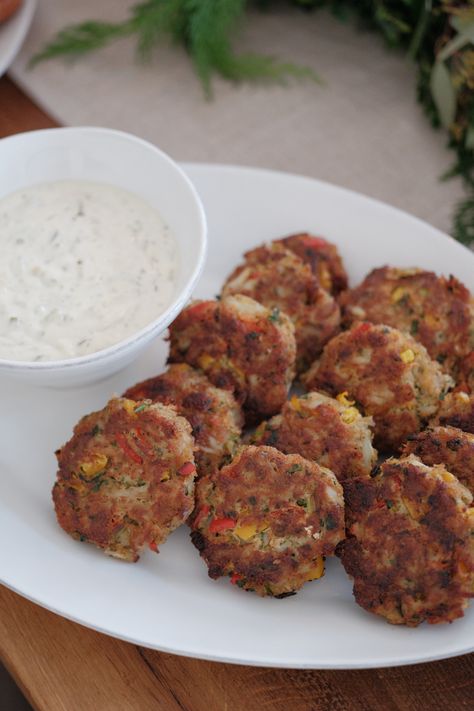 Delectable lump crab meat, tangy peppers, and spicy cilantro all pack a flavor-filled punch that makes these Gluten Free New England Crab Cakes a party favorite. The crunchiness of the patty combined with a soft dollop of creamy tartar sauce brings bold flavor that satisfies with each bite. Gluten Free Crab Cakes, Entertaining Appetizers, Lump Crab Meat, Crab Cake Recipe, Lump Crab, Beeswax Tapers, Crab Cake, Holiday Snacks, Super Bowl Sunday