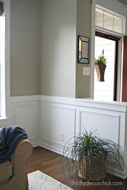 square molding on walls.  Half wall bookcase before. Half Wall Framing, Picture Frame Molding Half Wall, Lower Wall Paneling Ideas, Build A Half Wall, Foyer Wainscoting, Pony Wall Ideas, Half Wall Decor, Half Wall Room Divider, Half Wall Ideas