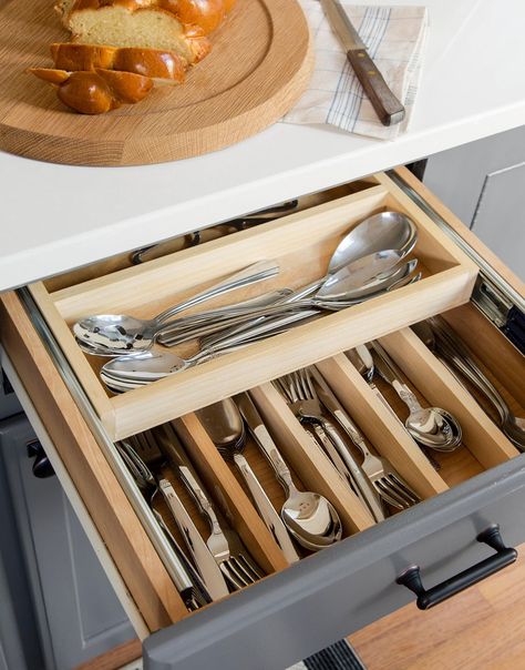 Boost kitchen organization inside your silverware drawer with custom inserts. Here, dividers sort forks, knives, and spoons, and a second tier slides into view when needed. #kitchenstorage #pulloutkitchenstorage #kitchenideas #kitchenstorageideas #bhg Cleaning Silverware, Organize Utensil Drawer, Clean Silverware, How To Clean Silverware, Silverware Storage, Kitchen Utensil Storage, Silverware Drawer, Kitchen Pots, Utensil Drawer