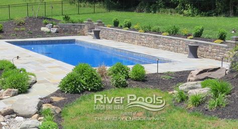 Fiberglass Pools!! Plus Concrete, Vinyl, and Above Ground Info | retaining walls Landscape Ideas Retaining Wall, Pools With Retaining Walls Sloped Backyard, Pool Retaining Wall, Hillside Pool, Landscaping Around Pool, Pool Landscape Ideas, Inground Pool Landscaping, Simple Pool, Rectangle Pool