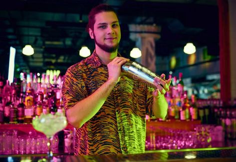 Portrait of bartender shaking cocktail shaker making alcohol sweet tasty cocktails at bar with modern design and neon stock photography Making Alcohol, Neon Photo, Neon Stock, Tasty Cocktails, Cocktails Bar, Cocktail Shaker, Stock Photography, Modern Design, Neon