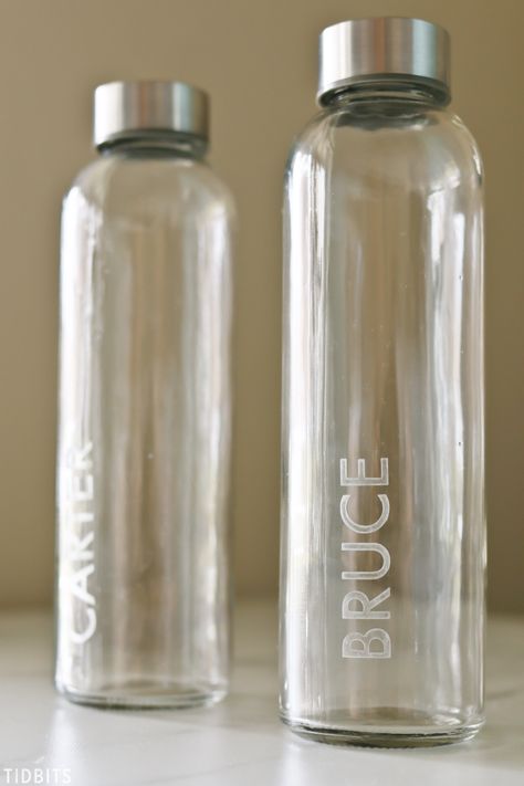 DIY Personalized Etched Glass Water Bottles - a gift idea for anyone on your list, and a great family gift. #giftidea #giftforanyone #etched #etchedglass #waterbottle #personalized #camitidbits #holidaygift #holidaygiftidea #christmasgift Glass Water Jug, Glass Water Bottles, Wedding Water Bottles, Diy Water Bottle, Water Bottle Gift, Recycling Ideas, Metal Water Bottle, Wedding Bottles, Best Water Bottle