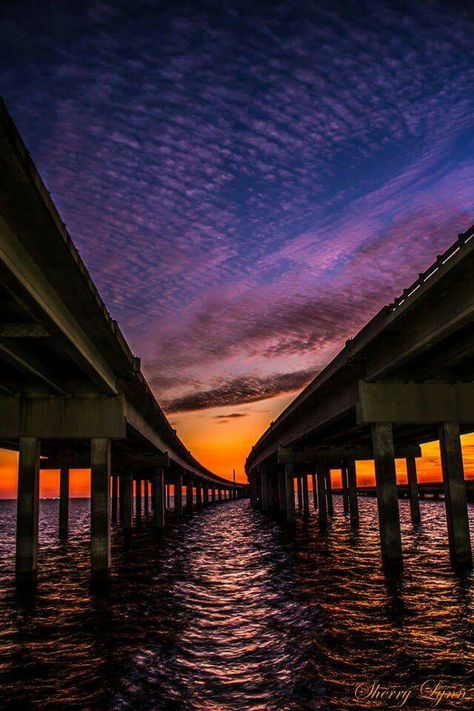 LAKE PONTCHARTRAN CAUSEWAY BRIDGE.....Mandeville to New Orleans, Louisiana....composed of two parallel bridges crossing Lake Pontchartrain....longest bridge over water in the world....the longer of the two bridges is 23.83 miles long.....supported by 9,500 concrete pilings.....opened in 1956.... operates as a toll bridge Bridge Over Water, Louisiana History, Louisiana Travel, Lake Pontchartrain, Dream Photography, Sea To Shining Sea, Kid Friendly Trips, Lake Sunset, New Orleans Louisiana