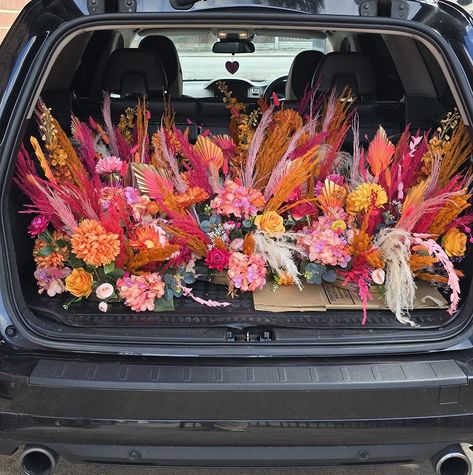 Beautiful pampas centerpieces placed on metal table stands/plinths Made with a mix of pink and orange pampas grass, dried flowers, and the single stem flowers are all artificial. With my custom palms to match the wedding scheme. I actually show myself sometimes 😆. I absolutely loved making these decorations. My workshop is completely bare now they have all gone. If you would like to discuss your wedding flowers, please send a message and I would be happy to help. All of these decorat... Pampas Grass Wedding Flowers, Dried Flower Wedding Table, Flower Props, Grass Centerpiece, Grass Wedding, Future Apartment Decor, Diy Centerpieces, Western Wedding, Pampas Grass