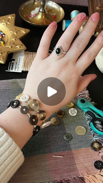 Ɠɾօէէօ🪡 on Instagram: "How to make a Button Bracelet ✨🪡 like friendship bracelets for crafters! #buttons #diyjewelry #jewlerymaking #sewing #crafts #vintageaesthetic #coraline" Button Necklace Tutorial, Button Necklace How To Make A, Button Bracelet Diy Simple, Bracelets With Buttons, Button Diy Ideas, How To Make Button Bracelets, Button Jewelry Diy How To Make, Button Bracelet Tutorial, How To Make A Button Bracelet