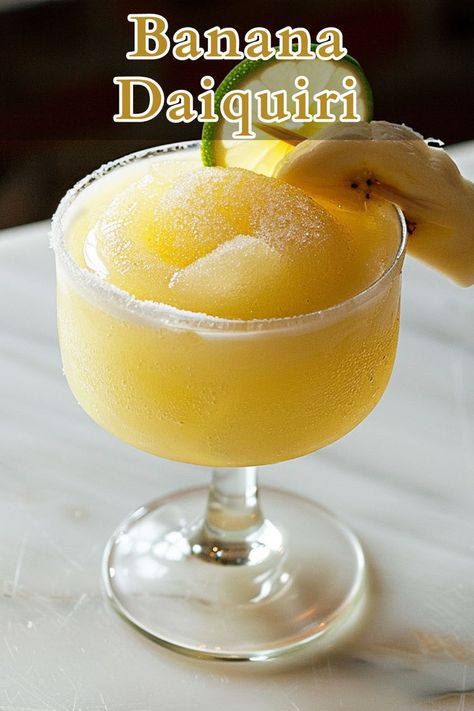 A Banana Daiquiri is a tropical cocktail that combines the rich flavors of dark and light rum with the sweetness of banana liqueur and fresh banana. Banana Liqueur Drinks, Banana Daiquiri, Banana Liqueur, Liqueur Drinks, Daiquiri Recipe, Most Popular Cocktails, Light Rum, Cocktail Recipes Easy, Long Drink