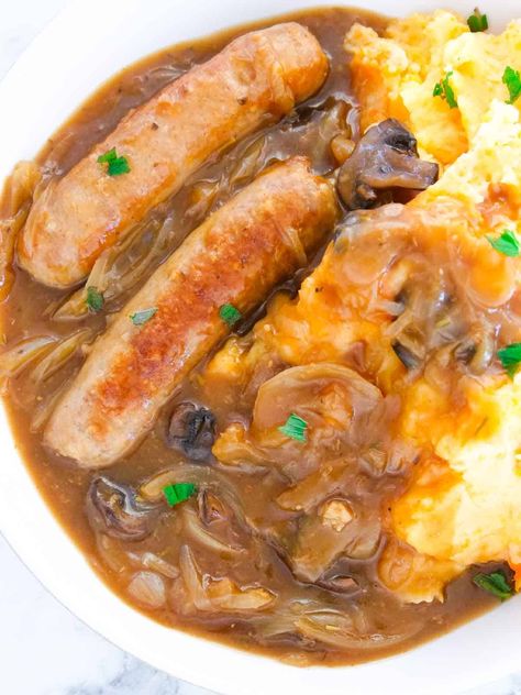 healthy pork sausages slow cooked in a rich onion gravy Slow Cooker Sausage And Onion Gravy, Slow Cooked Sausage Casserole, Sausage In Onion Gravy, Sausage Recipes In Crockpot, Stewed Sausages Recipe, Pork Sausages Recipe, Slow Cooker Recipes Sausage, Sausage Slow Cooker Recipes, Slow Cooker Vegetarian Recipes