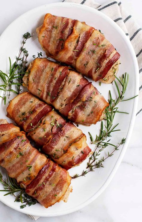 Wrapped in crispy bacon, these juicy, herbaceous Bacon Wrapped Pork Chops are so easy to make in your oven! A couple of simple secrets in this easy recipe guarantee perfect results every time. Perfect date night or dinner party main course. Party Main Course, Dinner Party Main Course, Quick Paleo Meals, Baked Stuffed Pork Chops, Brine For Pork, Bacon Wrapped Pork Chops, Oven Pork Chops, Dry Brine, Bacon Wrapped Pork