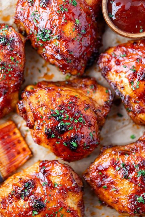 Oven Baked BBQ Chicken Thighs - juicy seasoned chicken thighs with a quick and delicious homemade barbecue sauce. Over Bbq Chicken, Chicken Thigh Recipes Bbq, Seasoned Chicken Thighs, Chicken Thighs Bbq, Baked Barbecue Chicken, Bbq Chicken Thigh Recipes, Bbq Roasted Chicken, Bbq Boneless Chicken Thighs, Bbq Chicken In Oven