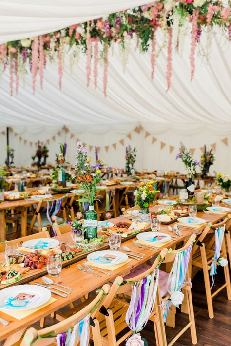 Multicoloured Flowers Floral Hanging Installation Gin Bottles Ribbon Back Chairs Spring Cottage Rivington Wedding Emma B Photography #Multicoloured #Flowers #Floral #Hanging #Installation #Gin #Bottles #Ribbon #Back #Chairs #wedding Marquee Decoration, Hanging Installation, Festival Style Wedding, Festival Themed Wedding, Spring Cottage, Sharing Platters, Festival Logo, Boho Wedding Flowers, Festival Theme