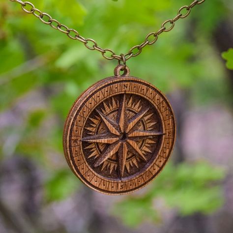 Get ready to explore new horizons with this handmade wooden compass necklace. Ideal for adventurers, travelers, and those who seek direction in life, this compass pendant is a truly unique and one-of-a-kind piece that reflects your love for exploring the world. Whether you're looking for a gift for a friend, family member, or loved one, or simply want to treat yourself to a new piece of jewelry, this wooden compass necklace is sure to make a statement. Direction In Life, Boho Style Accessories, Wilderness Explorer, Rose Medallion, Compass Pendant, Compass Necklace, Book Jewelry, Compass Rose, Exploring The World