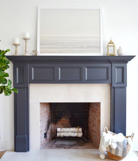 The fireplace paint color is Benjamin Moore Midnight Oil. Art is Patagonian Winter print from Minted.  #fireplaces Benjamin Moore Midnight Oil, Benjamin Moore Midnight, Coastal Castle, Painted Fireplace Mantels, Fireplace Paint, Grey Fireplace, Painted Fireplace, Cottage Fireplace, Fireplace Redo