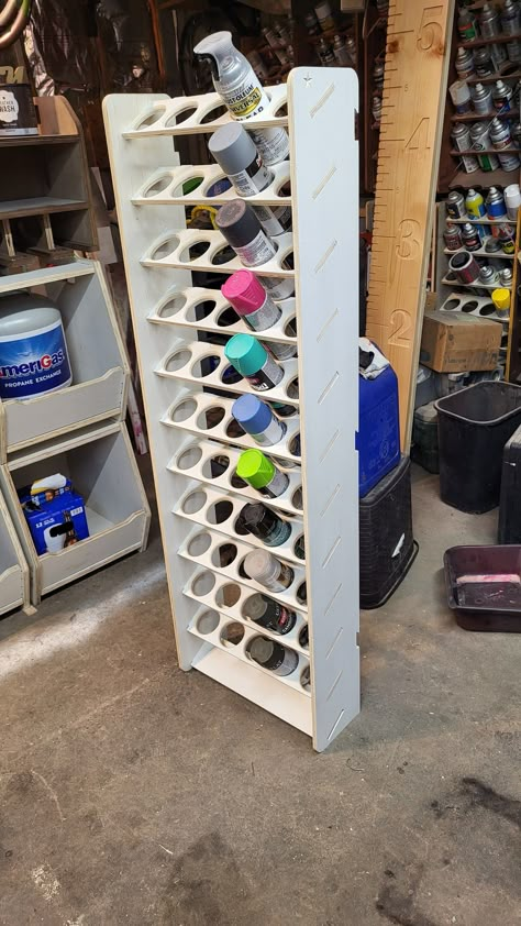 "This is a DIY wall mounted or free standing rattle can organizer. It is ready to assemble and finish. All parts have been sanded and fit checked.  Saves time looking for the spray can you need. Makes the area a lot neater. I can custom make them different sizes with different size/shapes of shelf holes. I can finish them as you like or send them unfinished. These are cut from 1/2\" plywood. I now include an 20 inch wall mounting cleat. Please note; The price of lumber and shipping boxes has inc Spray Paint Storage, Garage Projects, Garage Workshop Organization, Garage Organization Diy, Tool Storage Diy, Wooden Pallet Furniture, Horseshoe Crafts, Paint Storage, Shop Projects